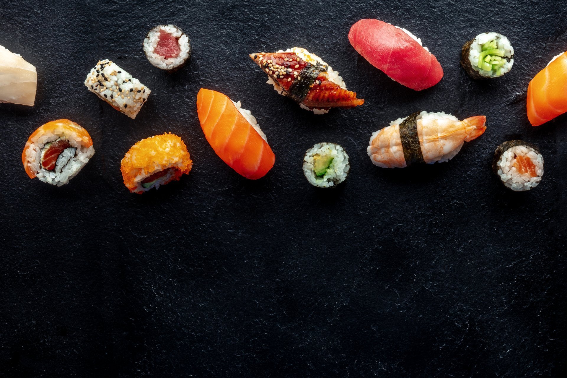 Sushi assortment on black slate