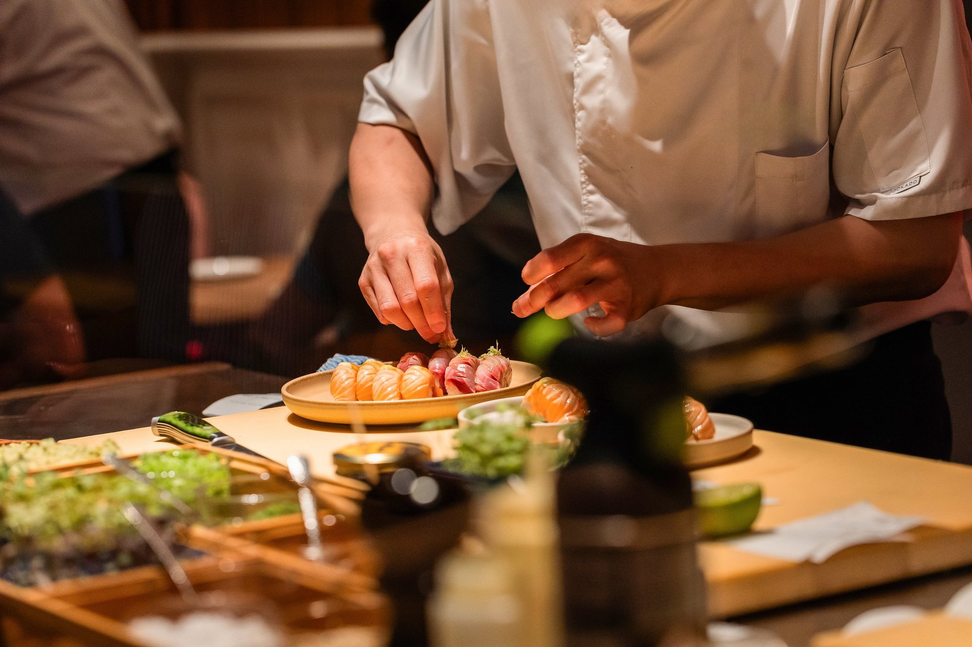Sushi chef preparing sushi